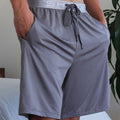 Model wearing SHEEX Men's Lounge Short in Graphite #choose-your-color_graphite