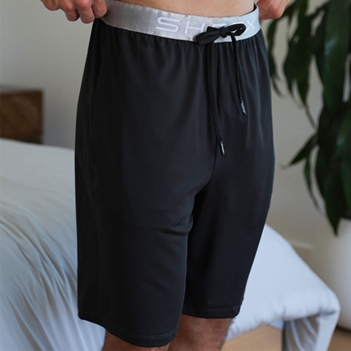 Model wearing SHEEX Men's Lounge Short in Black #choose-your-color_black