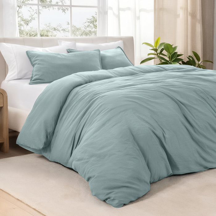 Angled view of bed with a duvet cover folded over on itself